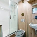 Sleeping Unit: Spacious full-height shower room completes the double bed & kitchen.